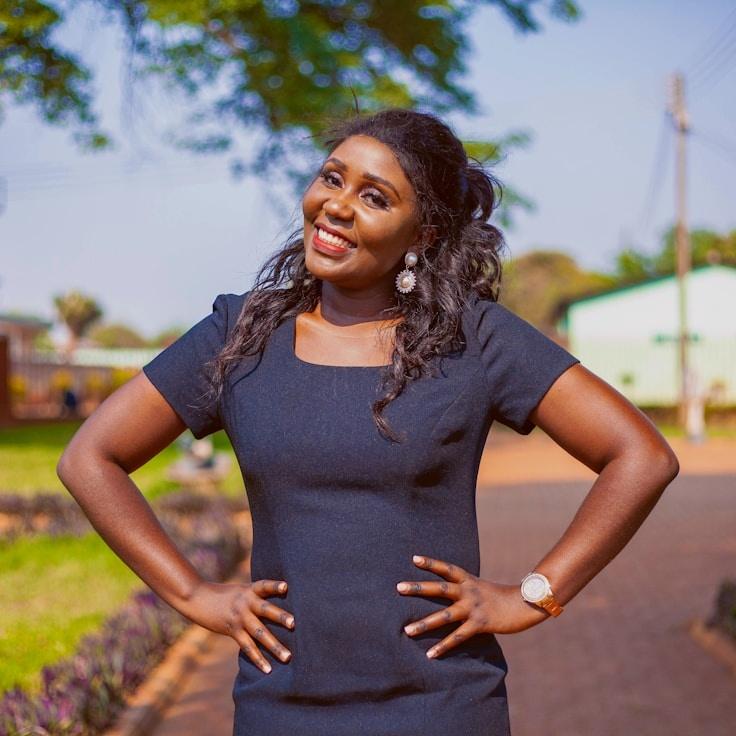 Alex Rivera, Lead Design Curator at RidgeHarborFolio, reviewing corporate floral arrangements